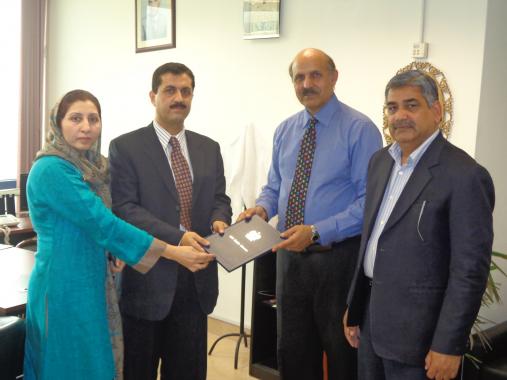 D.G Licensing PEMRA, Mr. Jumani Ashfak presenting Radio Meezan FM 96.6 license to Sr. Director R&P/ Station Director Muhammad Aamir Nazir & Director Human Rights, PHC Mrs. Rifat Nazir on Monday March 11, 2013